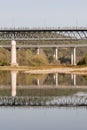 Vertical shot of the Lyduvenai Bridge over a river in the daylight in Lithuania