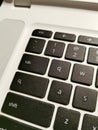 Vertical shot of a mac keyboard fragment - perfect for background Royalty Free Stock Photo