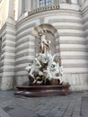 Vertical shot of Macht zur See fountain in front of historical building in Vienna, Austria