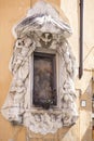 Vertical shot of the Madonnelle of the Rome sculpture on the street
