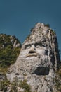 Vertical shot of the magnificent Rock Sculpture of Decebalus captured in Romania Royalty Free Stock Photo