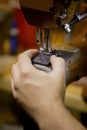 Vertical Shot of Making a Full Box Stitch on Black Leather Royalty Free Stock Photo