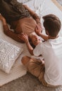 Vertical shot of a male chiropractor working with a female patient