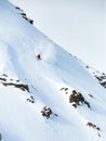 Vertical shot of a male skiing on the mountain covered with snow in winter