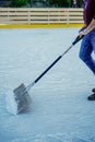 Vertical Shot of Man Cleaning Snow from Ice with Shovel Royalty Free Stock Photo