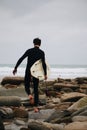 Vertical shot of a man doing surfing processed with VSCO