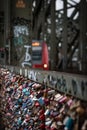 Vertical shot of many of padlocks hanging on Hohenzollern Bridge in Cologne, Germany