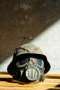 Vertical shot of mask with helmet props to play airsoft games or as a war decoration