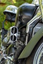Vertical shot of a mechanical detail of a motorcycle outdoors