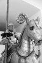 Vertical shot of a medieval knight with a horse in full barding