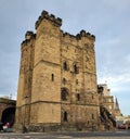 Vertical shot of a medieval Newcastle Castle against a cloudy sky Royalty Free Stock Photo