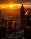 Vertical shot of the Messeturm or Trade Fair Tower in Frankfurt with a golden sunset sky