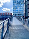 Vertical shot of the metal bridge with the Mailbox and Cube buildings in the background. Birmingham.