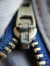 Vertical shot of a metallic zipper of a jacket