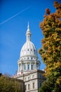 Vertical shot of the Michigan capital buildings with a blue sky in the background