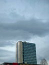 Vertical shot of the Microsoft building center in Belgrade, Serbia against the dark cloudy sky