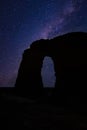 Vertical shot of a milky way galaxy seen from the rocky arch