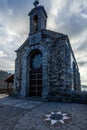 Vertical shot of a Mirador chapel at the top of San Juan Gaztelugatze islet in Bakio, Spain Royalty Free Stock Photo