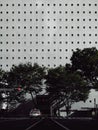 Vertical shot of modern architecture. The car against the modern building.