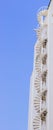 Vertical shot of a modern building with outdoor staircases against a blue sky. Royalty Free Stock Photo