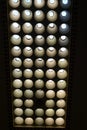 Vertical shot of a modern ceiling with numeral minimalist light bulbs
