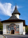 Vertical shot of the monastery with a mural on the entrance wall in Cormaia village, omania