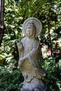 Vertical shot of the Monte Palace Tropical Garden Buddhistic statue in Funchal, Portugal