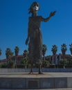 Vertical shot of the Monument to the Mother of Migrants wearing a protective mask in Asturias, Spain