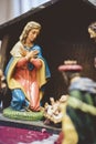 Vertical shot of mother Mary at born of Christ figurine