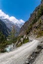 Vertical shot of the mountain road by the river towards Dhikur Pokhari village, Kaski, Nepal