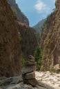 Vertical shot of the mountainous area in a park in Greece with balanced rocks in front of them