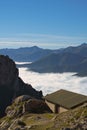 Vertical shot of the mountains of the Picos de Europa Natural Park with clouds in between
