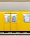 Vertical shot of a moving yellow train