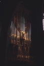 Vertical shot of the musical organ in the darkness in the concert hall Royalty Free Stock Photo