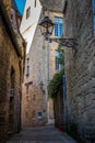 Vertical shot of a narrow alley with medieval houses in Sarlat, France