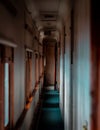 Vertical shot of narrow corridor inside a train Royalty Free Stock Photo