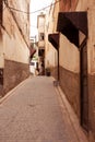 Vertical shot of a narrow street in a medieval town Royalty Free Stock Photo