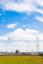 Vertical shot of a Natural Gas Refinery against the blue sky