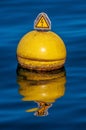 Vertical shot of a nautical buoy floating in the water of Lake Geneva in Switzerland