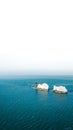 Vertical shot of the needles on the Isle of Wight in the United Kingdom with a white background Royalty Free Stock Photo