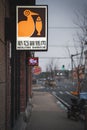 Vertical shot of the Neolithic Barbeque Restaurant Logo in the streets in Shanghai, China