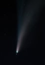 Vertical shot of the NEOWISE comet sky in the dark sky Royalty Free Stock Photo
