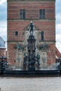 Vertical shot of the Neptune Fountain in front of the Frederiksborg castle in Hilerod, Denmark Royalty Free Stock Photo