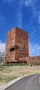 Vertical shot of the the newest building at Skejby Hospital in Denmark in blue sky background