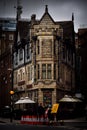 Vertical shot of a nice pub on the corner building in busy London Royalty Free Stock Photo