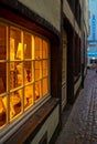 Vertical shot of a nicely-illuminated window in old Town Cologne, Germany Royalty Free Stock Photo