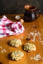 Vertical shot of oats cookies on rustic wooden table with egg sh