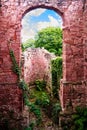 Vertical shot of an old arched gate of the castle ruins Royalty Free Stock Photo