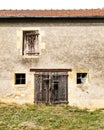 Vertical shot of an old beautiful cottage captured on a sunny day in the French Countryside Royalty Free Stock Photo