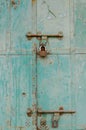 Vertical shot of an old blue peeling paint door,rusty hinges,padlock,Mandawa haveli Rajasthan India Royalty Free Stock Photo